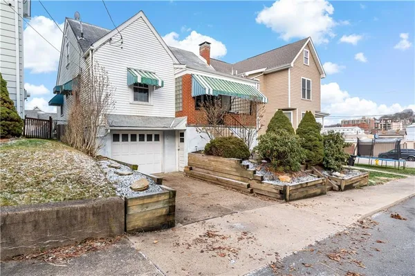 a front view of a house with a garage