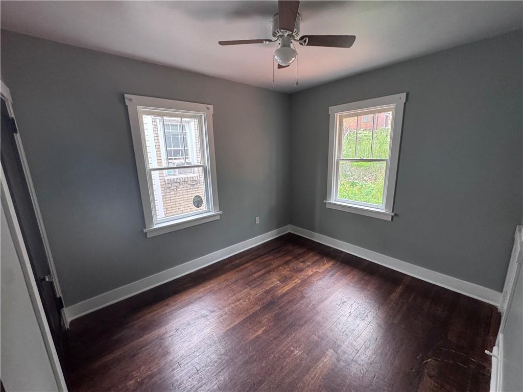 2733 Pyramid Avenue Pittsburgh, PA 15227 - Photo 12 of 14 a view of an empty room with wooden floor and a window
