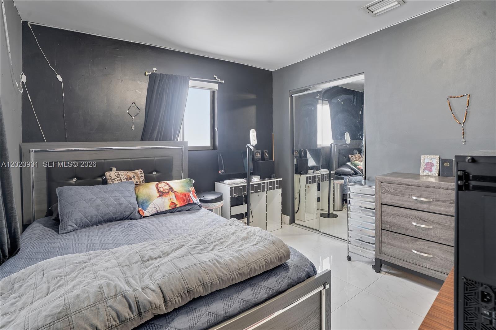 1360 Northwest 77th Street Miami, FL 33147 - Photo 13 of 41 a bedroom with a bed and mirror