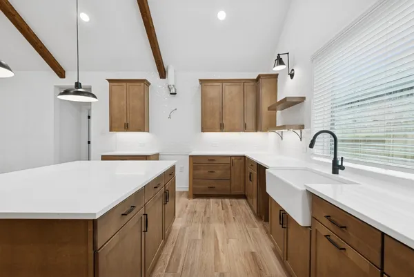a spacious bathroom with a double vanity sink a mirror and a bathtub