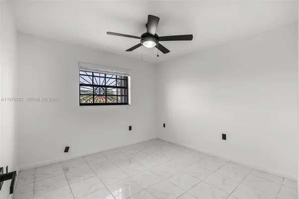 an empty room with windows