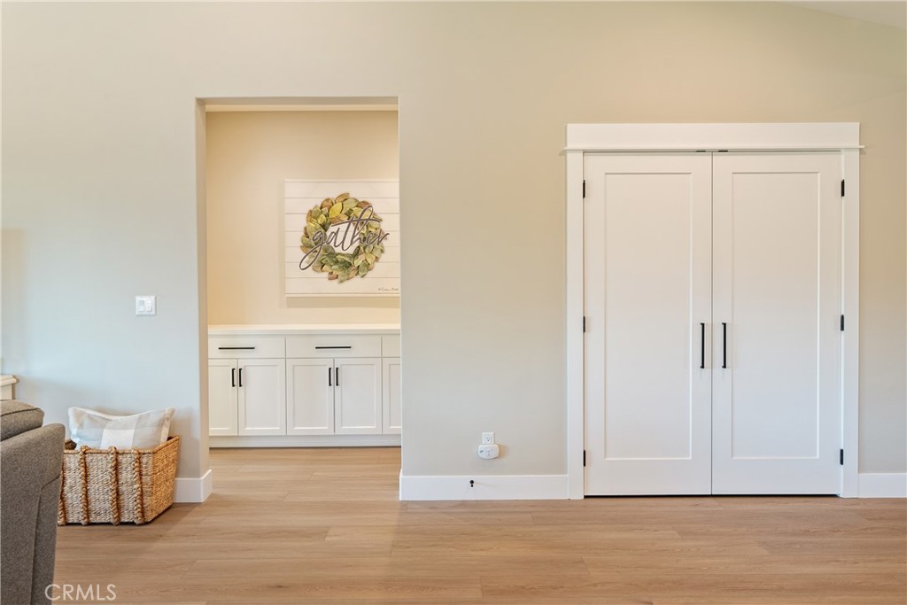 8550 El Corte Road Atascadero, CA 93422 - Photo 22 of 72 Lets see the primary suite. The doors on the right are a large coat closet. The primary suite is on the opposite side of the home from the guest bedrooms.