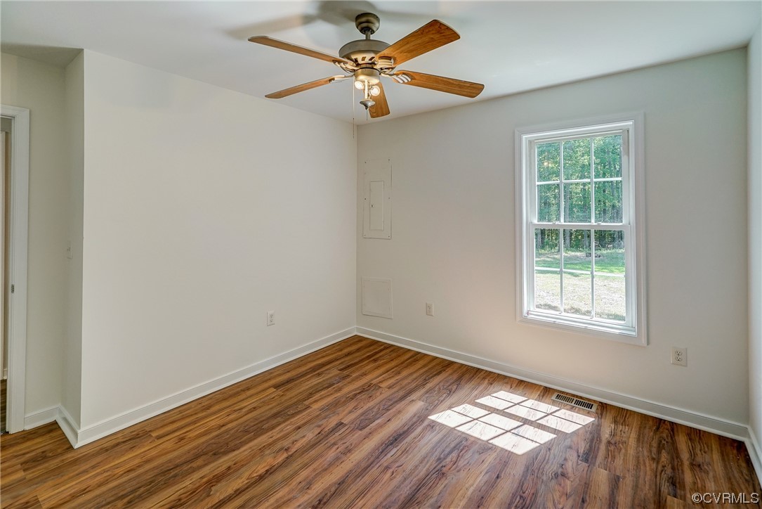 11277 Egypt Road Ashland, VA 23005 - Photo 33 of 46 Hardwood floored spare room with a healthy amount of sunlight and ceiling fan