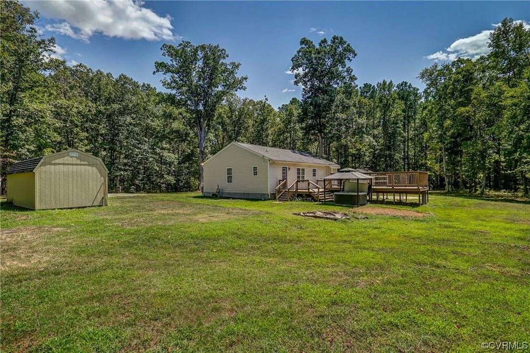 11277 Egypt Road Ashland, VA 23005 - Photo 38 of 46 View of yard featuring a storage unit and wooden deck