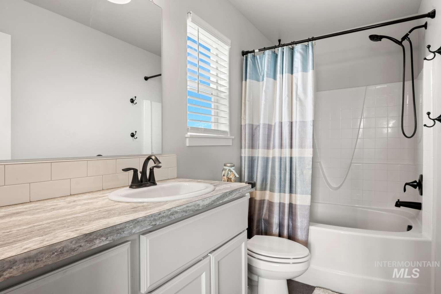 521 East 15th Street Rupert, ID 83350 - Photo 14 of 21 Full bathroom featuring shower / tub combo and vanity