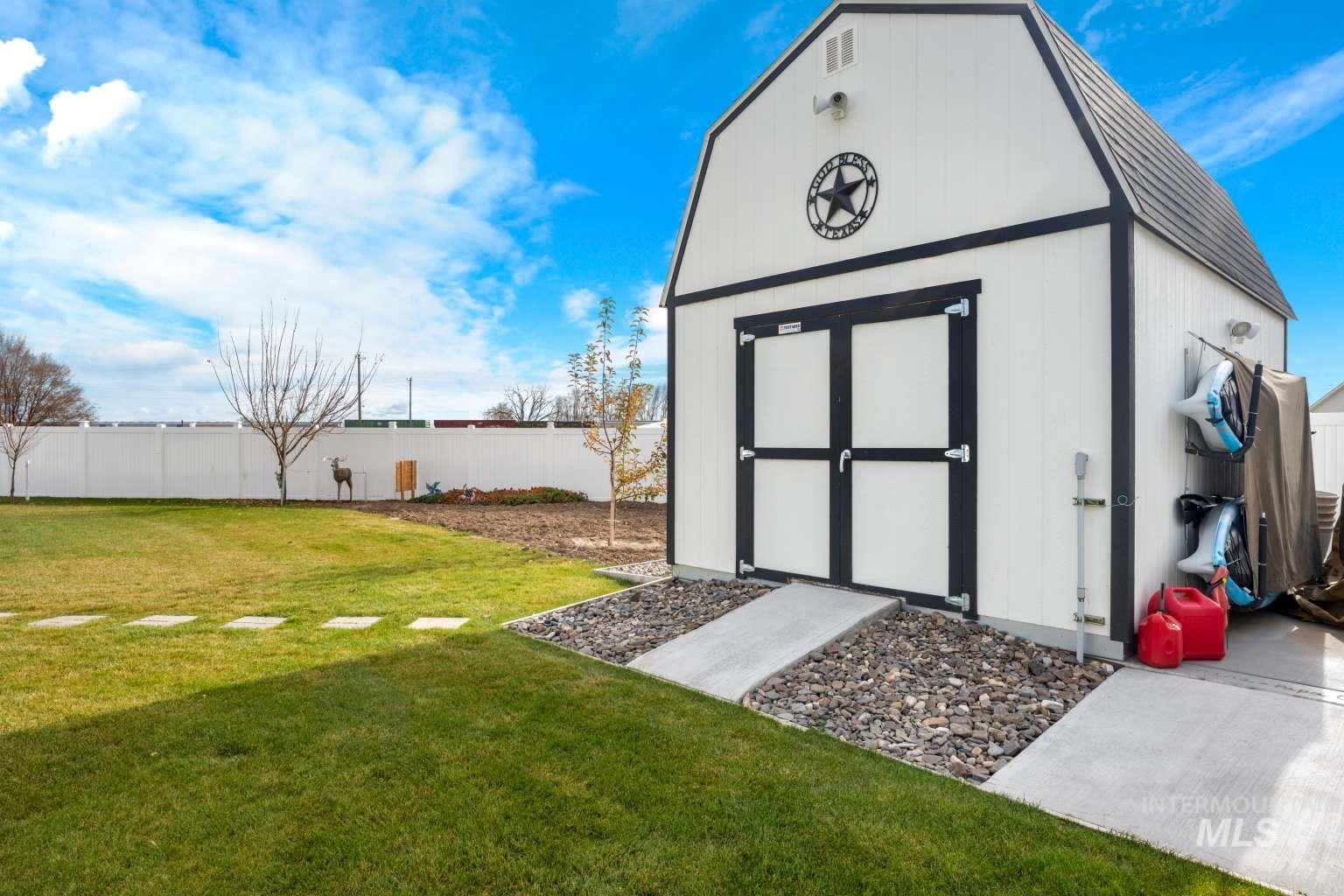 521 East 15th Street Rupert, ID 83350 - Photo 20 of 21 View of shed with a fenced backyard