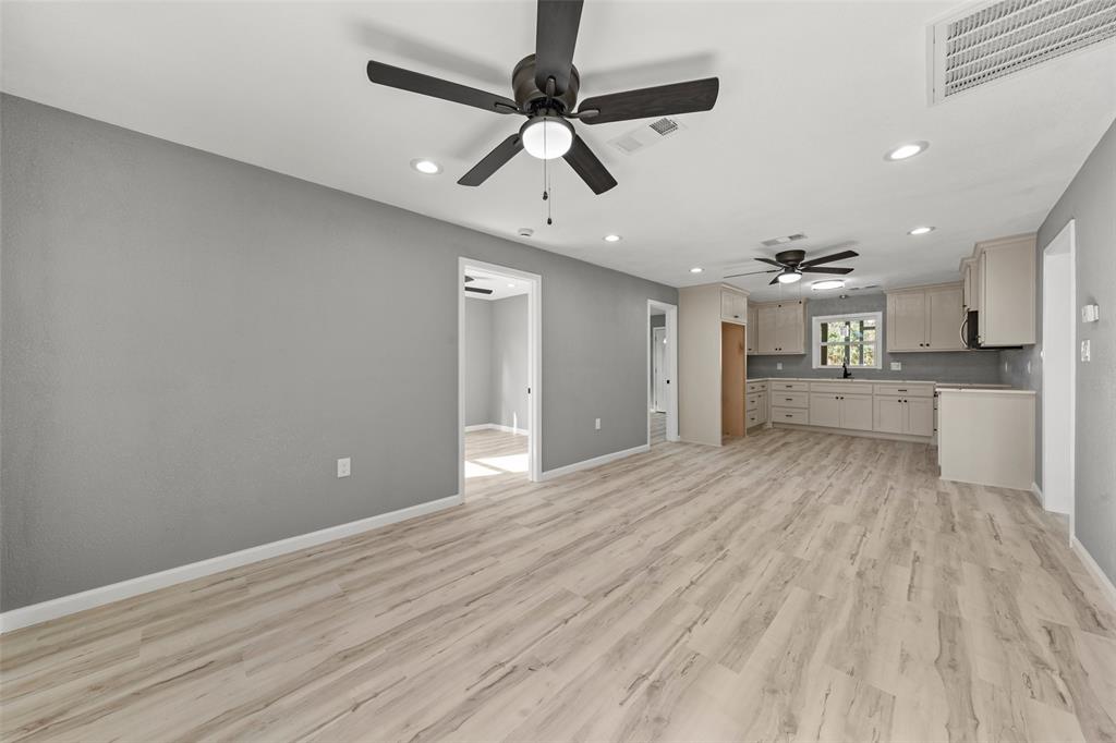 108 9th Street Valley Mills, TX 76689 - Photo 8 of 19 a view of an empty room and kitchen view