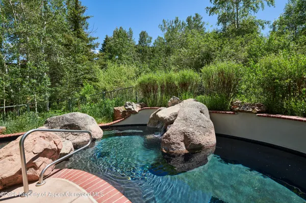 a view of a backyard with sitting area