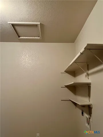 a bathroom with a granite countertop sink toilet and a mirror