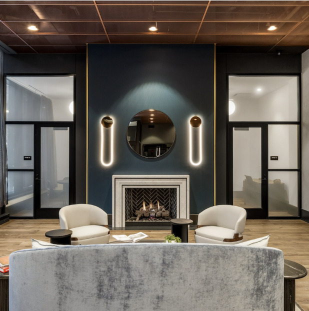 741 North Wells Street, Unit 1401 Chicago, IL 60654 - Photo 2 of 12 a living room with furniture and a fireplace