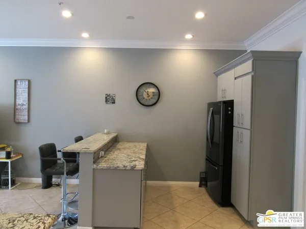 a view of a storage & utility room with two washing machine