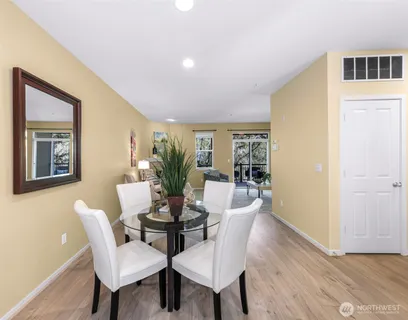 a dining room with furniture and window
