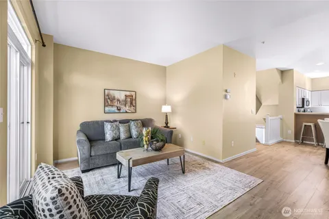 a living room with furniture and a rug