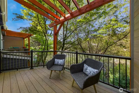 a balcony with wooden floor and outdoor space
