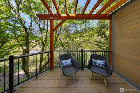 a view of a chair and table in the balcony