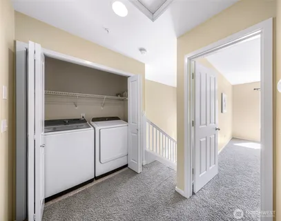 a bedroom with a bed lamp and window
