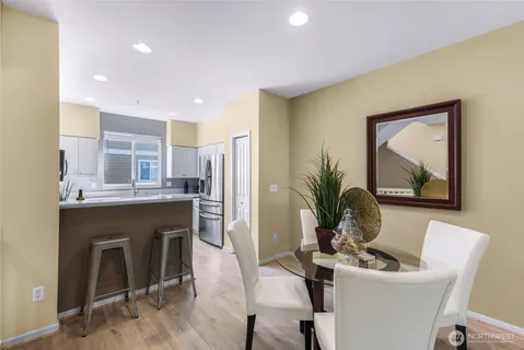 a dining room with furniture and window