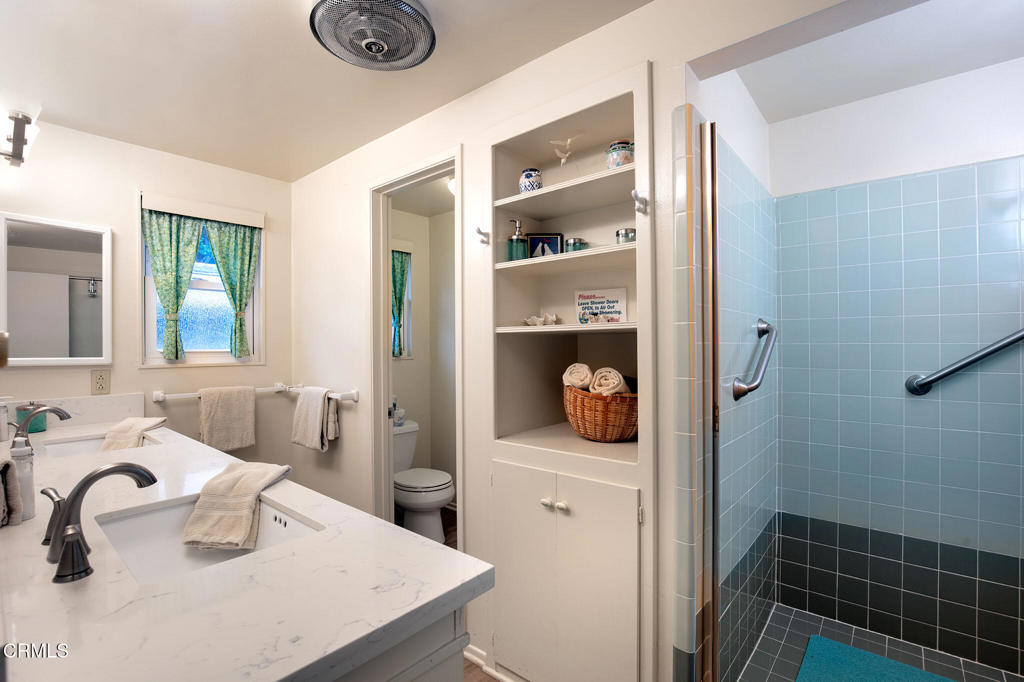 1235 Capri Way Oxnard, CA 93035 - Photo 13 of 21 a bathroom with a sink toilet and shower