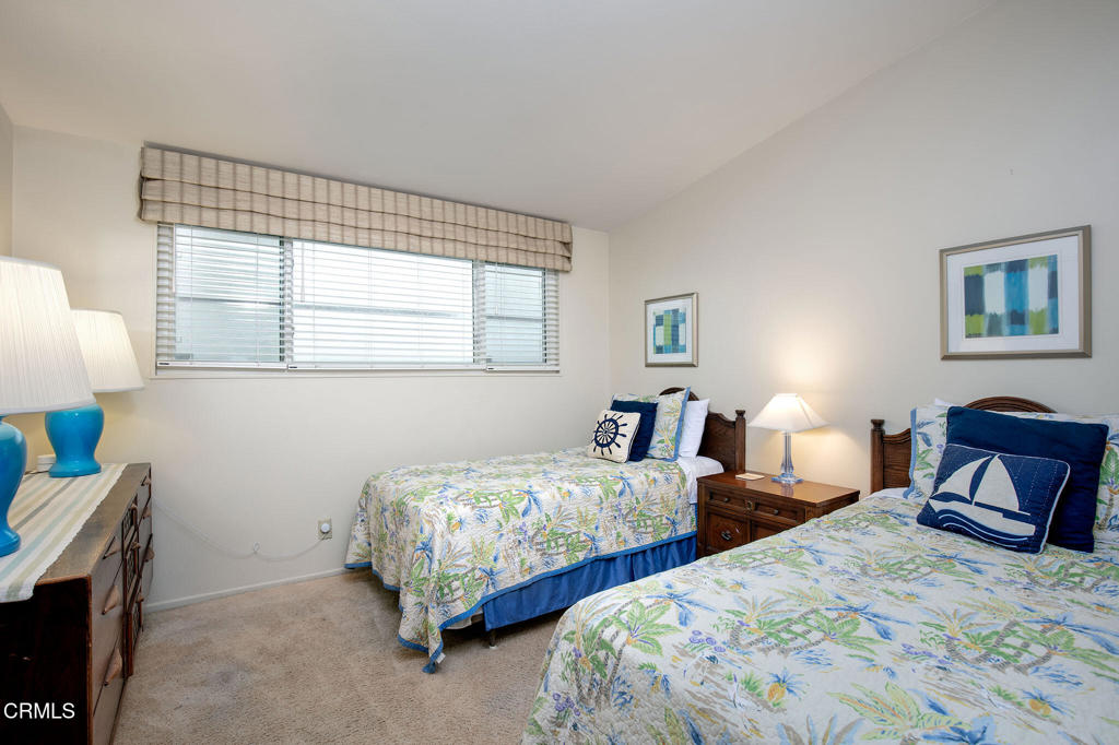 1235 Capri Way Oxnard, CA 93035 - Photo 15 of 21 a bedroom with two beds and a window