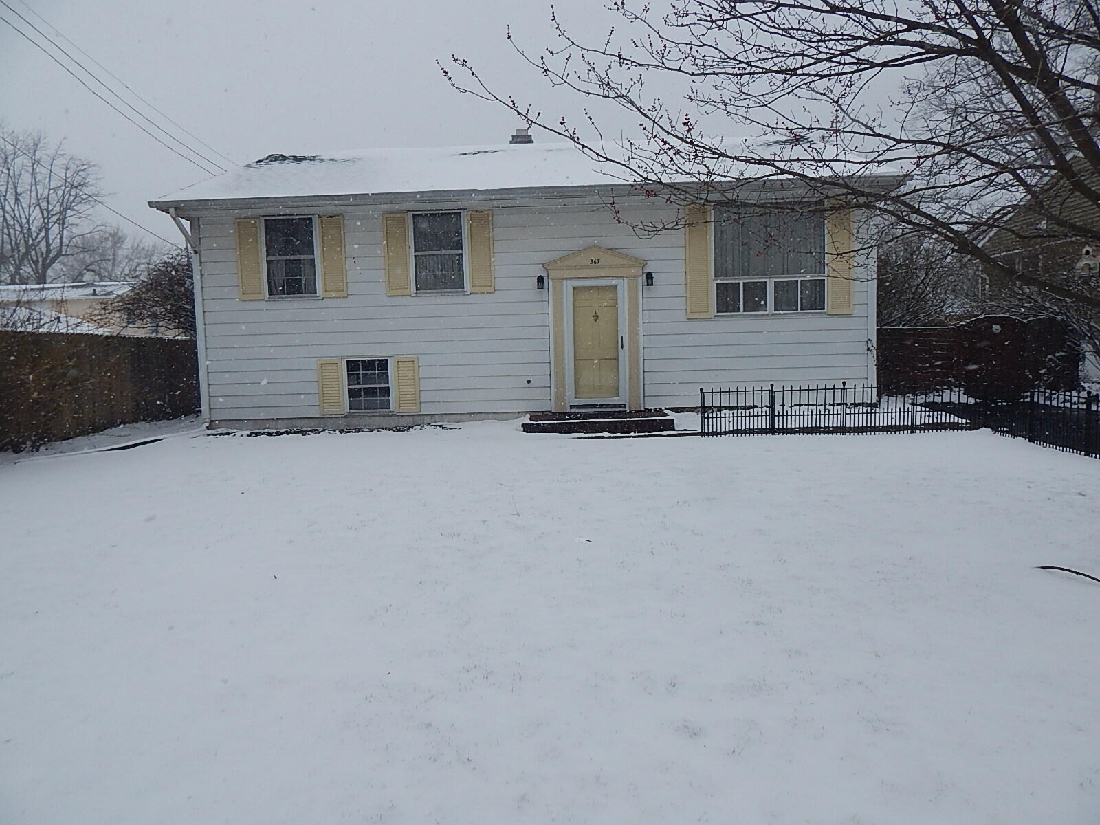367 Chestnut Street Michigan City, IN 46360 - Photo 1 of 11 a view of a house with a snow in the yard