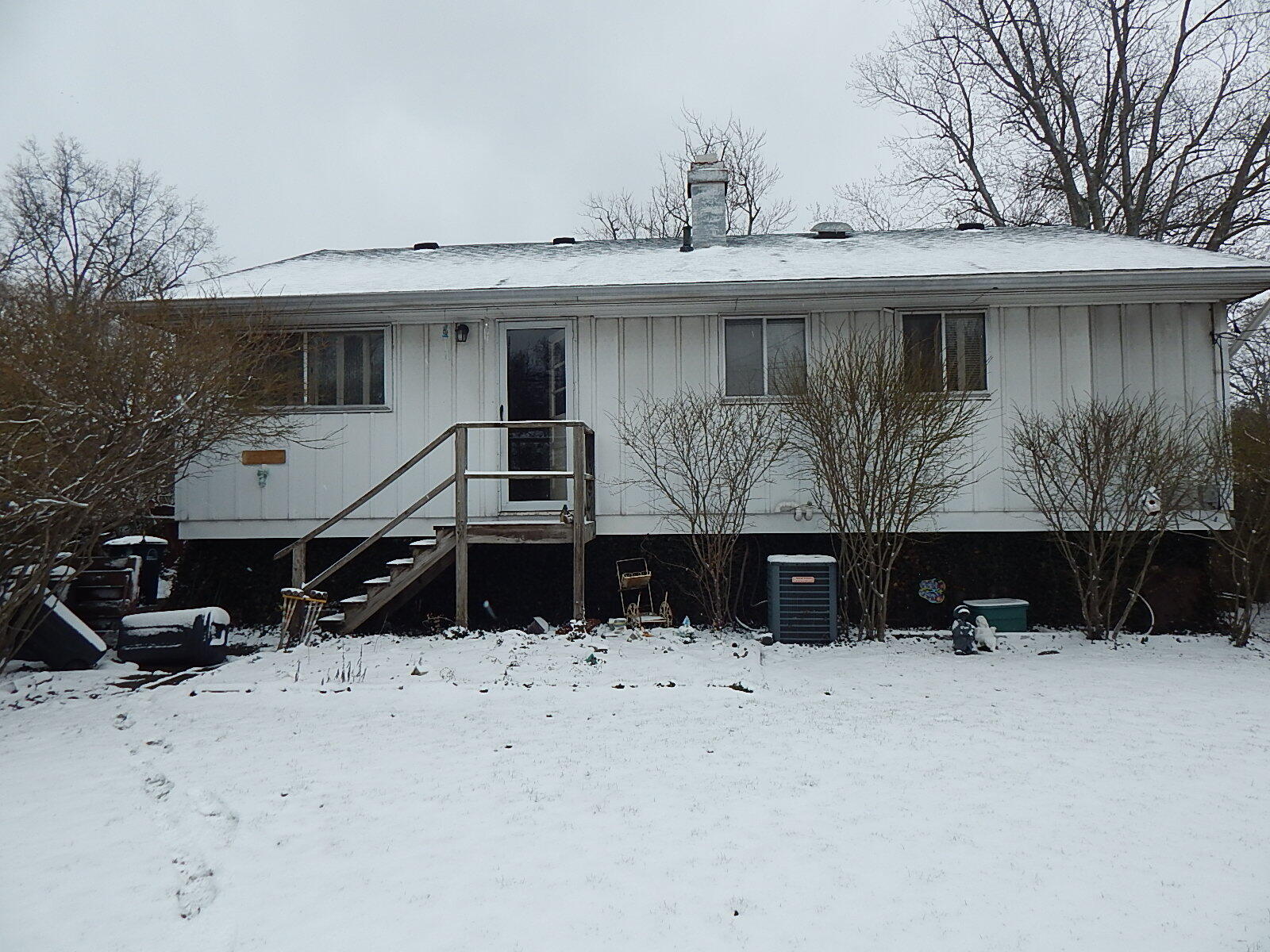 367 Chestnut Street Michigan City, IN 46360 - Photo 11 of 11 a view of house with yard covered in snow