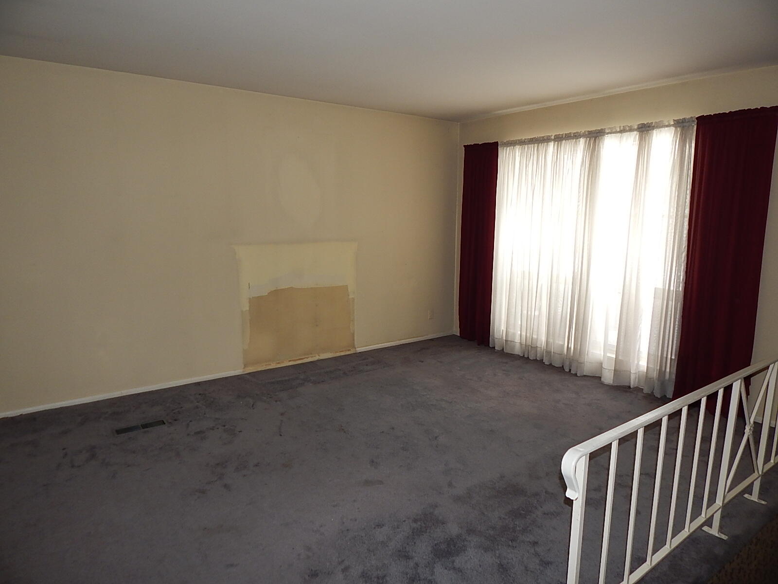 367 Chestnut Street Michigan City, IN 46360 - Photo 3 of 11 an empty room with windows