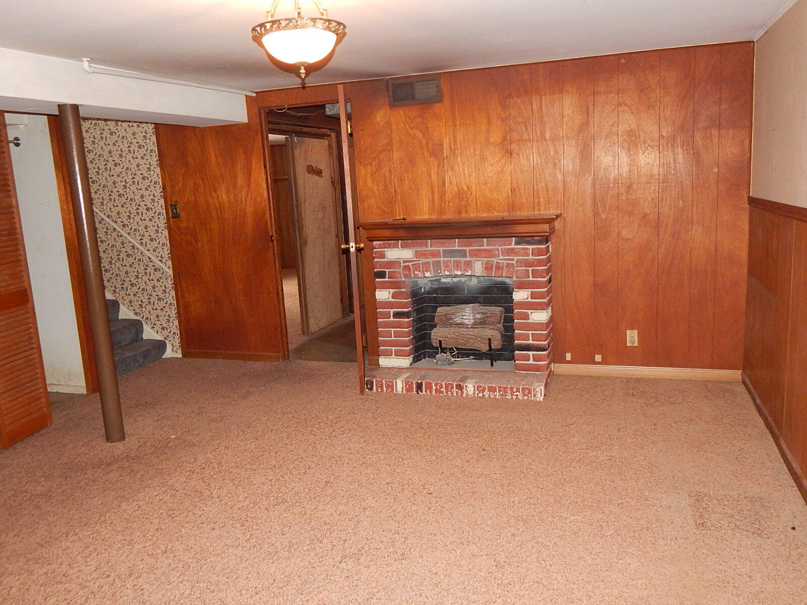 367 Chestnut Street Michigan City, IN 46360 - Photo 10 of 11 a view of an empty room with a fireplace