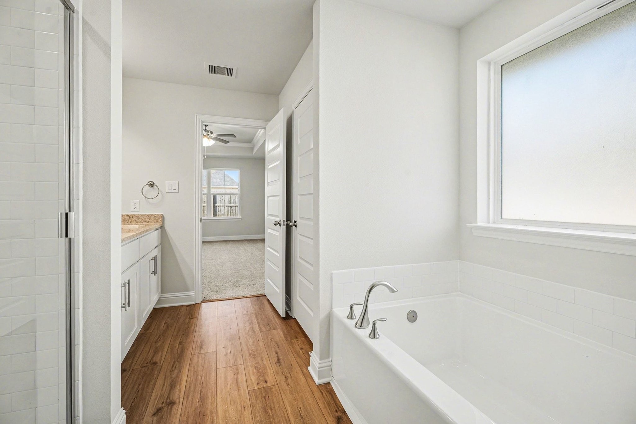 5 Keystone Court Angleton, TX 77515 - Photo 25 of 33 a bathroom with a bathtub and a shower