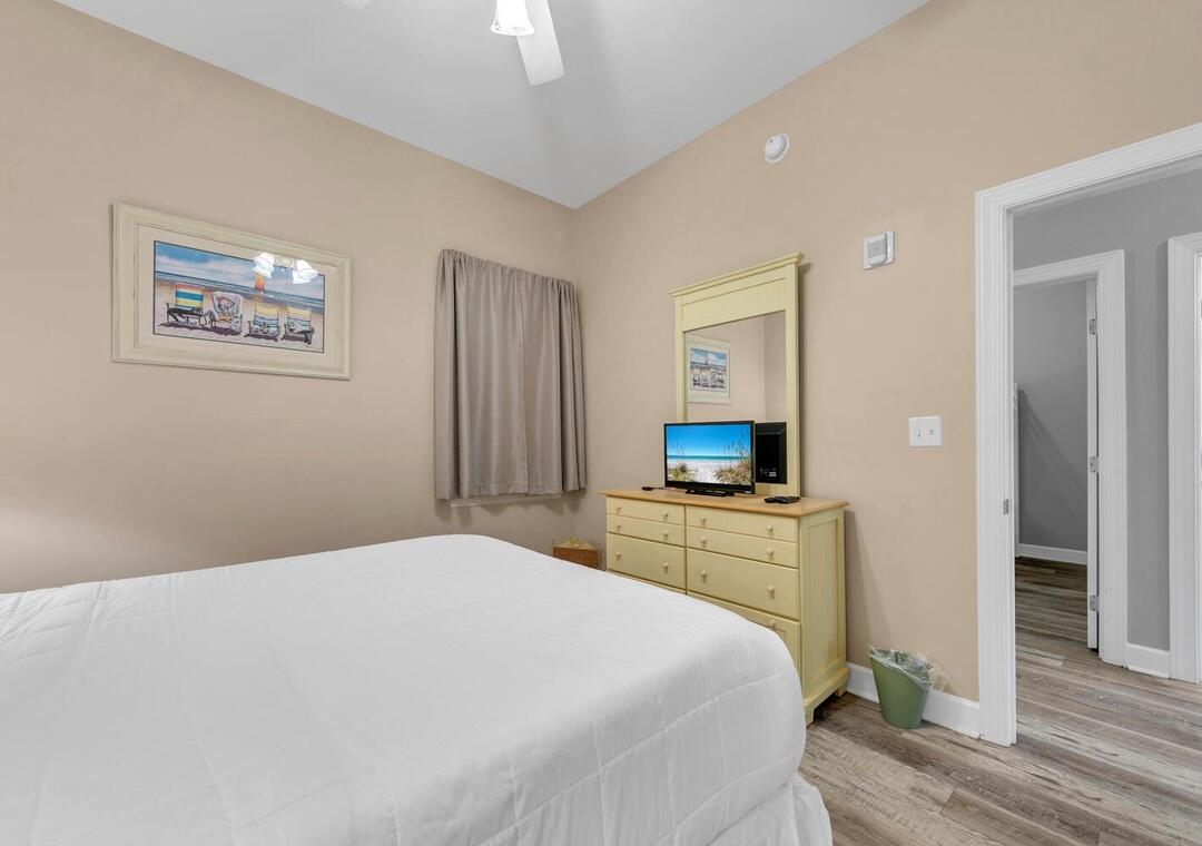 231 Somerset Bridge Road, Unit 2308 Santa Rosa Beach, FL 32459 - Photo 27 of 47 a bedroom with a bed and a flat screen tv