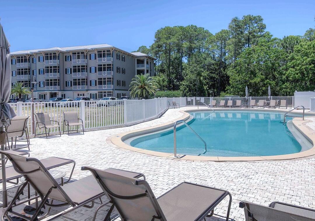 231 Somerset Bridge Road, Unit 2308 Santa Rosa Beach, FL 32459 - Photo 37 of 47 a view of a swimming pool with chairs