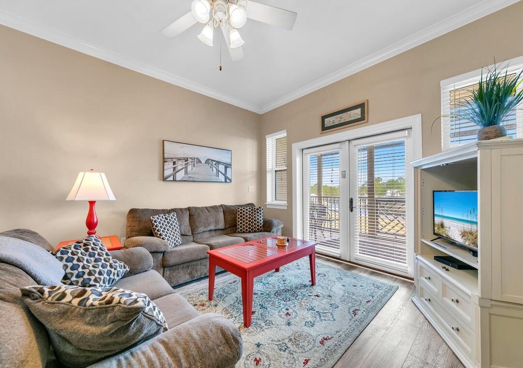 231 Somerset Bridge Road, Unit 2308 Santa Rosa Beach, FL 32459 - Photo 6 of 47 a living room with furniture and a flat screen tv