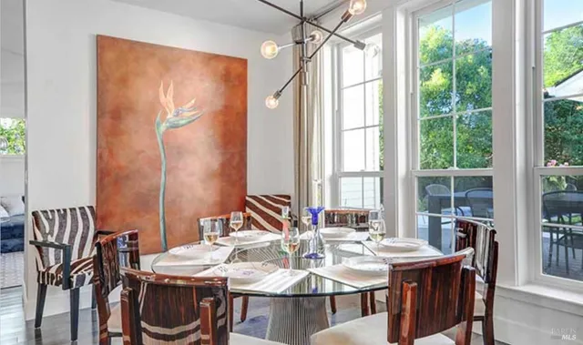 a view of a dining room with furniture window and outside view