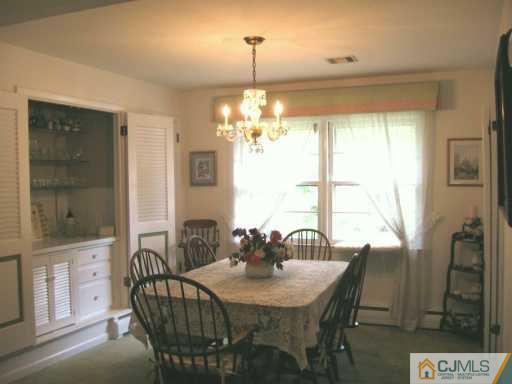 12 Ryan Road Cranbury, NJ 08512 - Photo 3 of 8 a view of a dining room with furniture and window