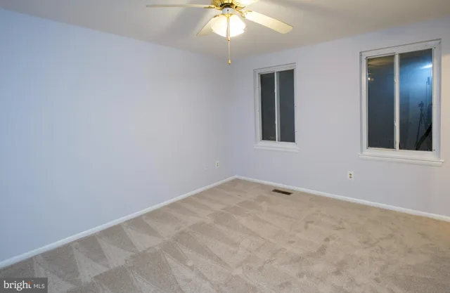 a view of an empty room and a hallway