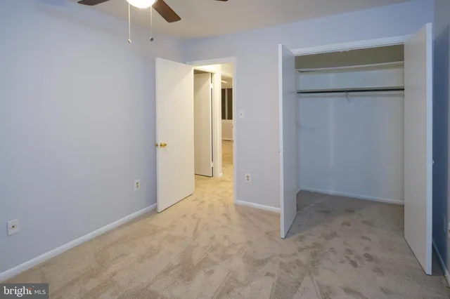 a view of staircase with white walls