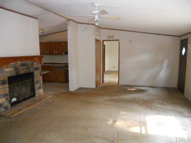 1332 Yakimas Road Raleigh, NC 27603 - Photo 4 of 9 a view of a livingroom with a fireplace