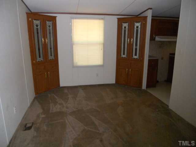 1332 Yakimas Road Raleigh, NC 27603 - Photo 5 of 9 an empty room with windows