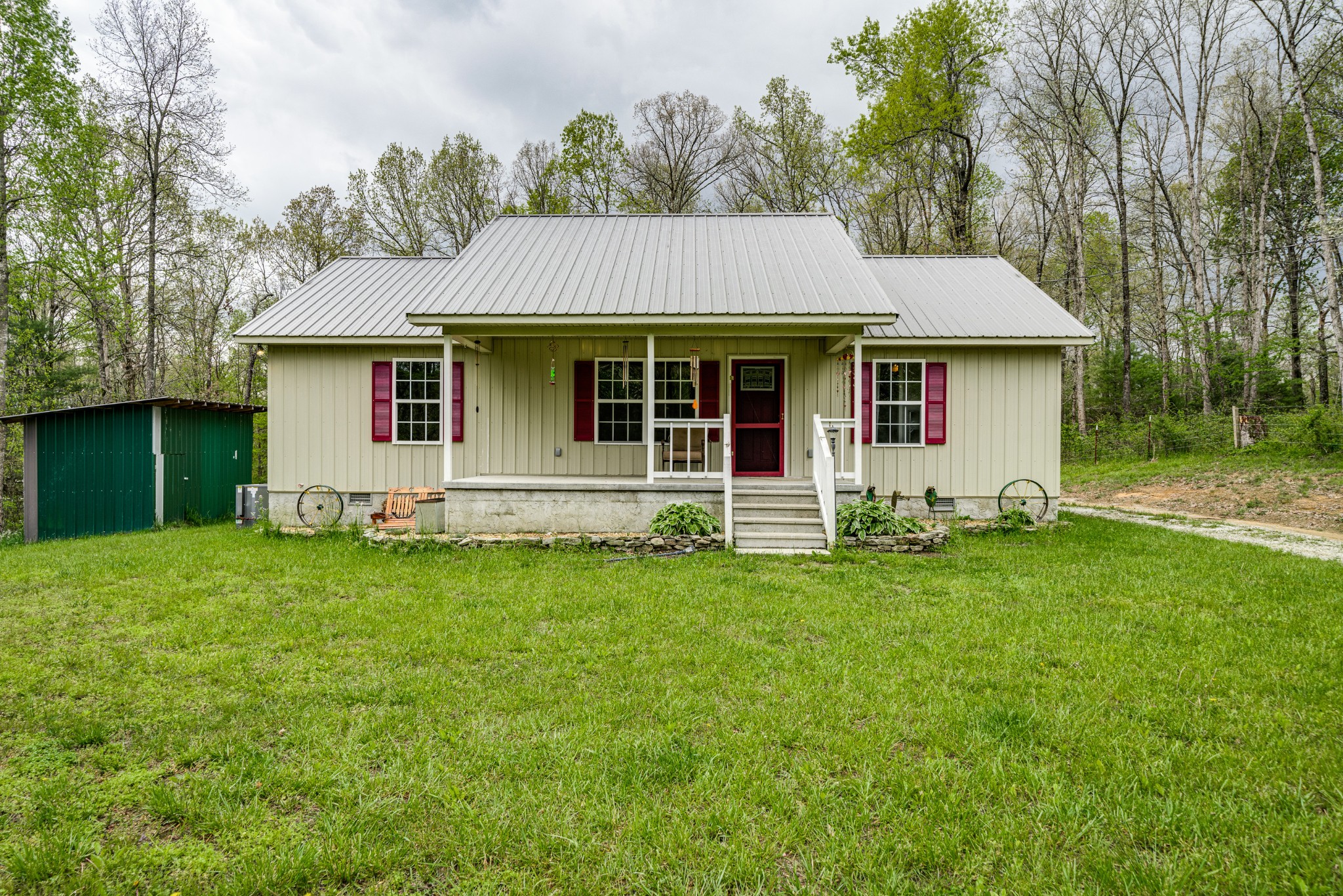 0 Lloyd Hall Loop Deer Lodge, TN 37726 - Photo 1 of 46 a front view of a house with a garden