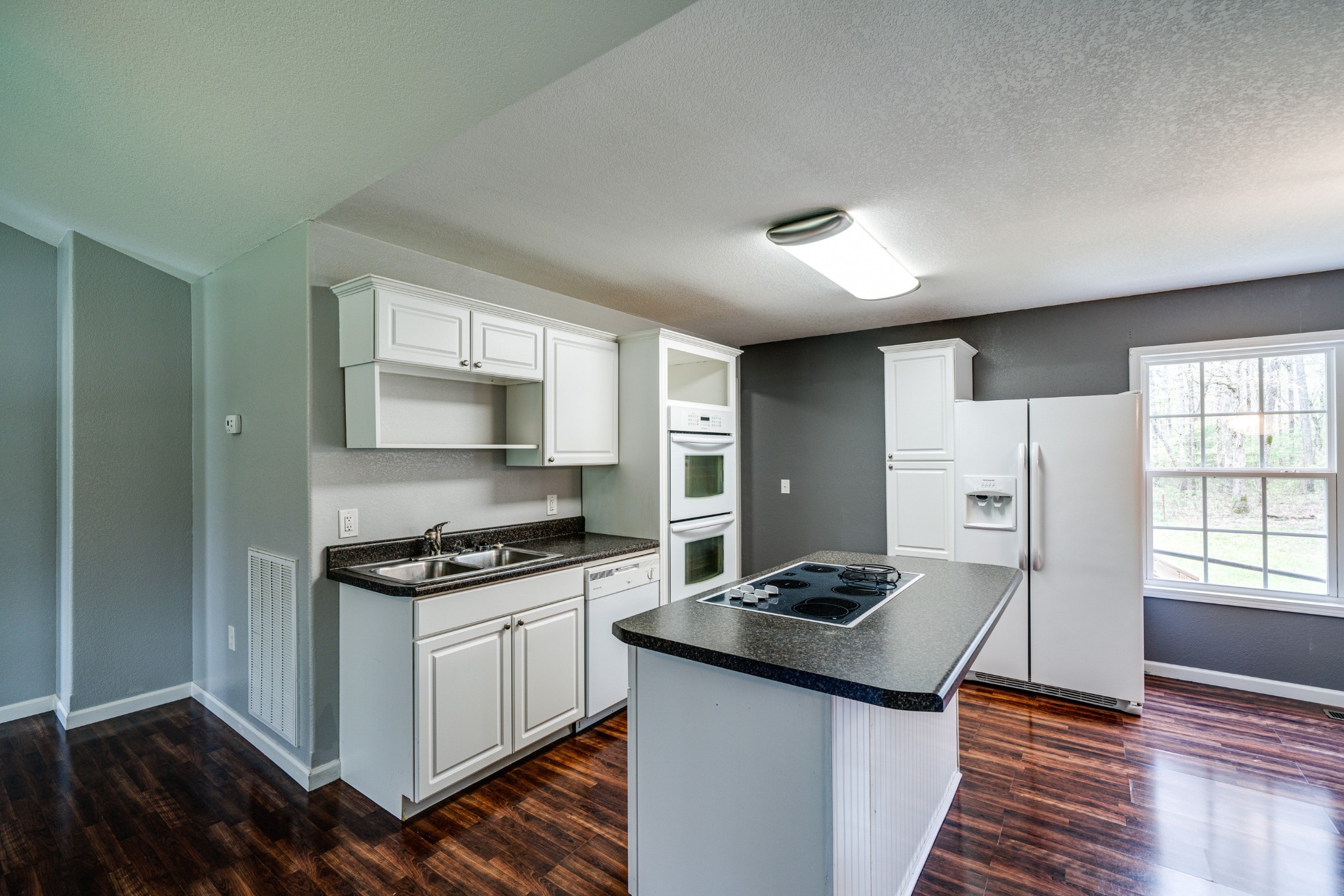 0 Lloyd Hall Loop Deer Lodge, TN 37726 - Photo 14 of 46 a kitchen with granite countertop a stove and a refrigerator