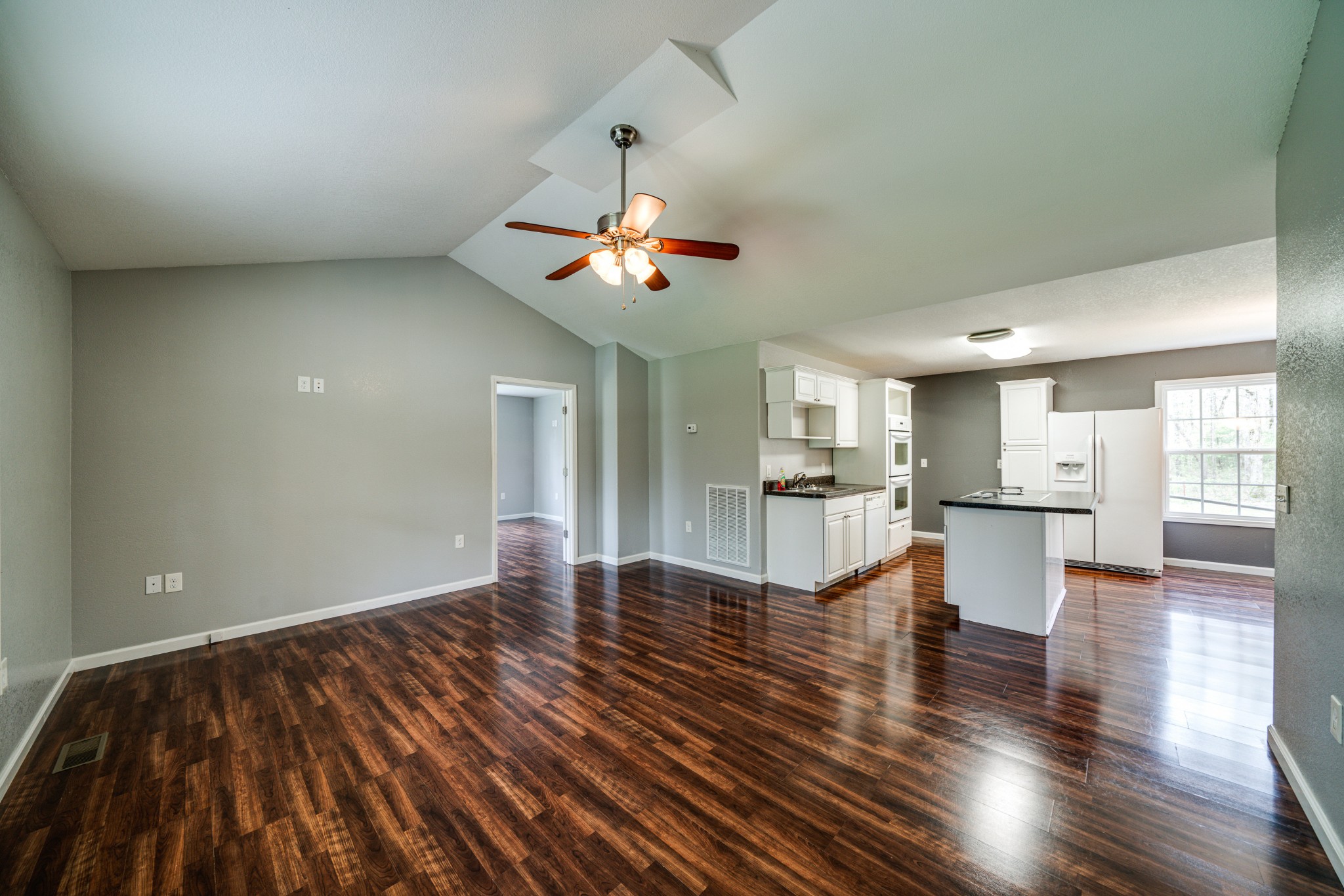 0 Lloyd Hall Loop Deer Lodge, TN 37726 - Photo 2 of 46 a view of an empty room and kitchen with wooden floor