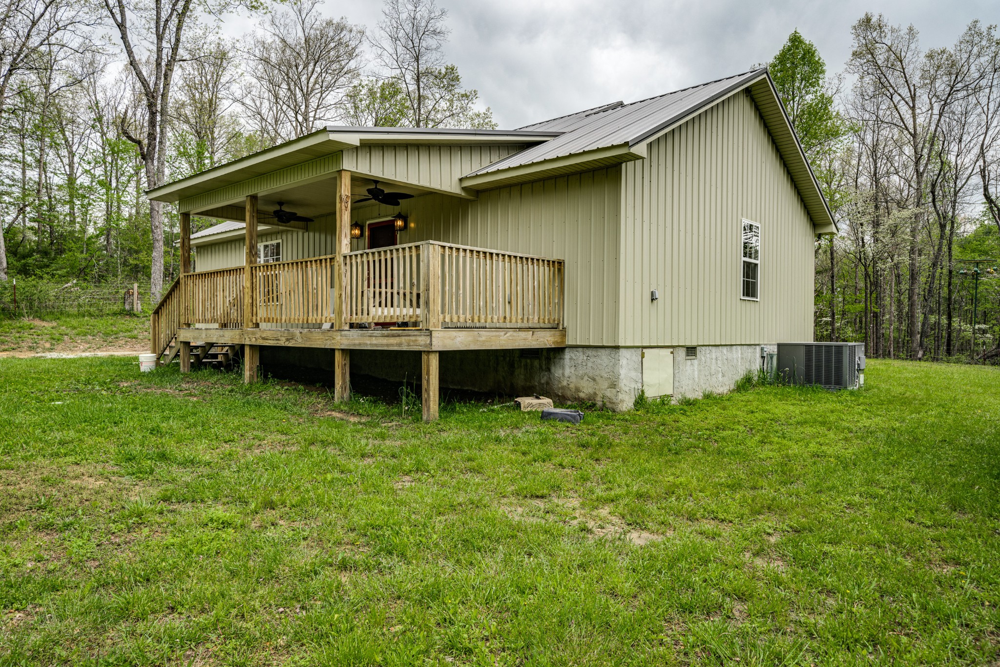 0 Lloyd Hall Loop Deer Lodge, TN 37726 - Photo 40 of 46 a small house with tall trees in the background
