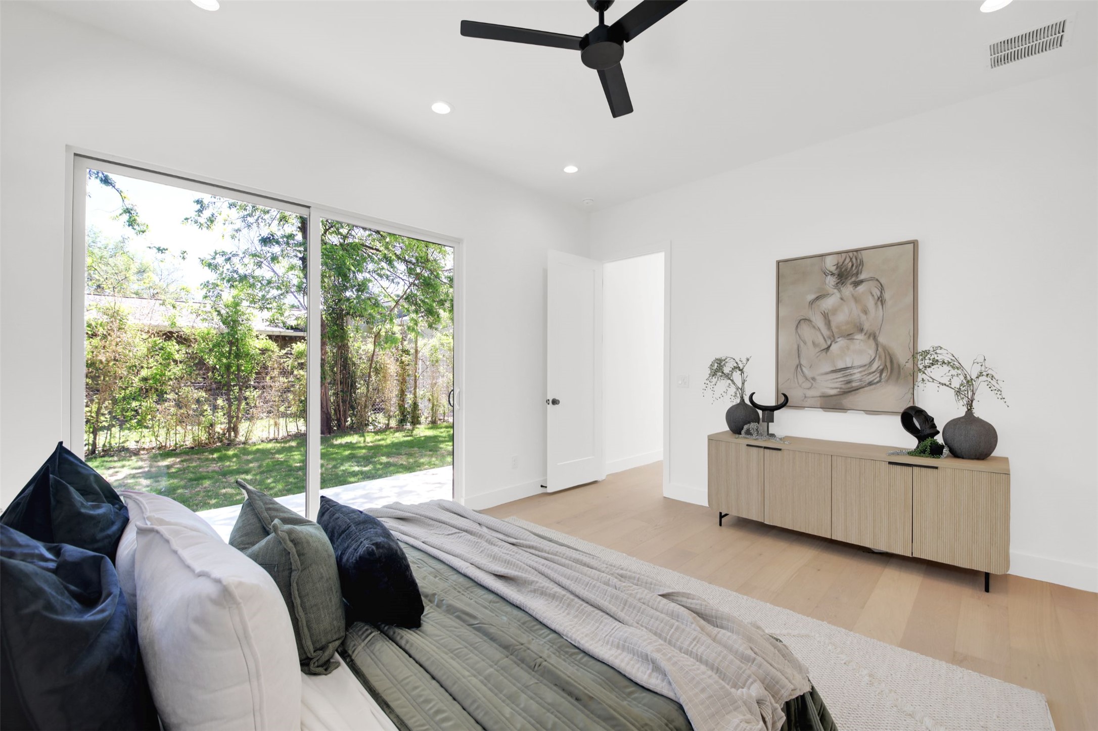 1310 Cullen Avenue Austin, TX 78757 - Photo 13 of 40 Primary bedroom with light wood flooring, recessed lighting, a ceiling fan, and access to exterior