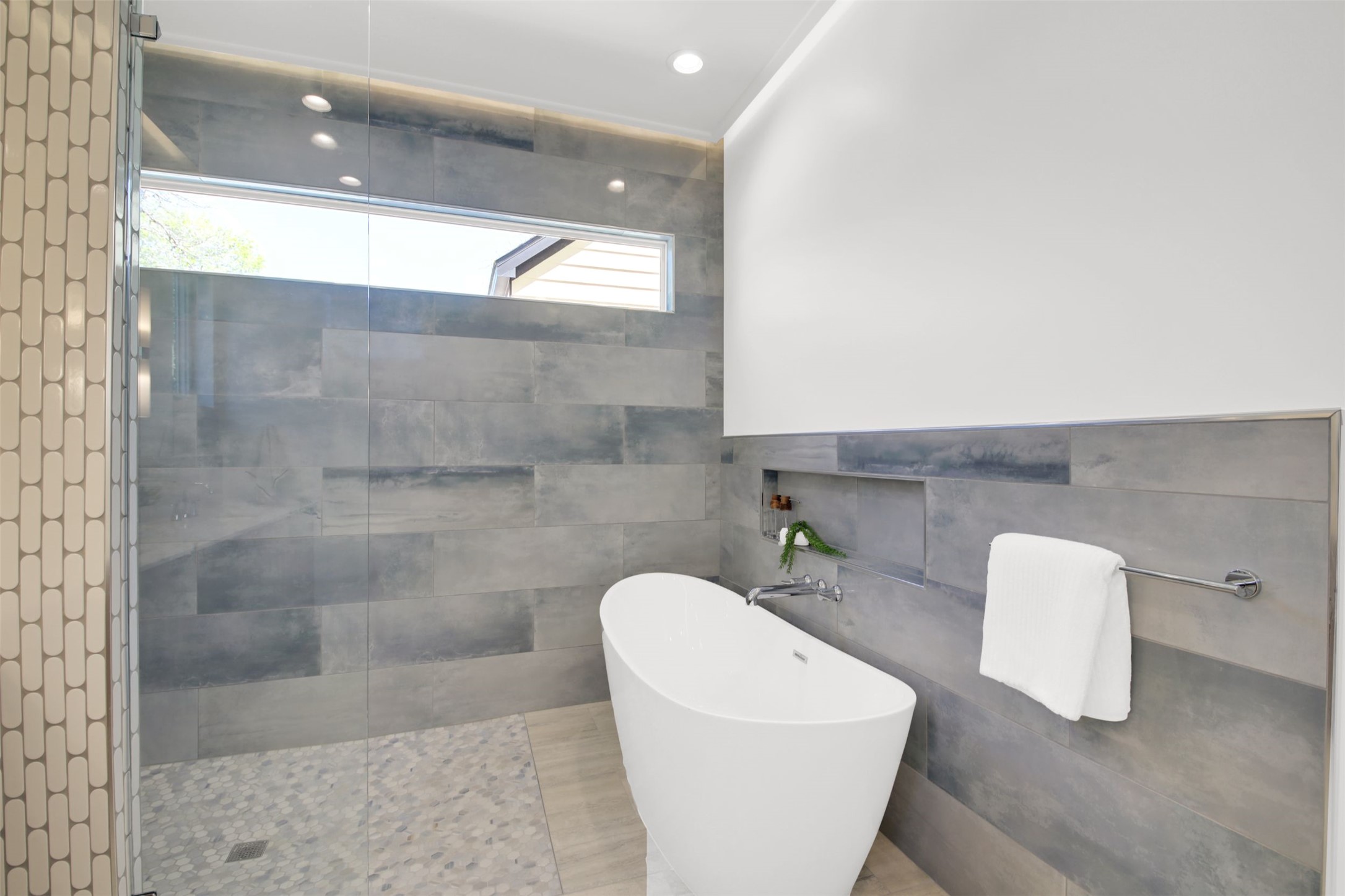 1310 Cullen Avenue Austin, TX 78757 - Photo 17 of 40 Full bathroom featuring a freestanding tub, walk in shower, tile walls, and recessed lighting