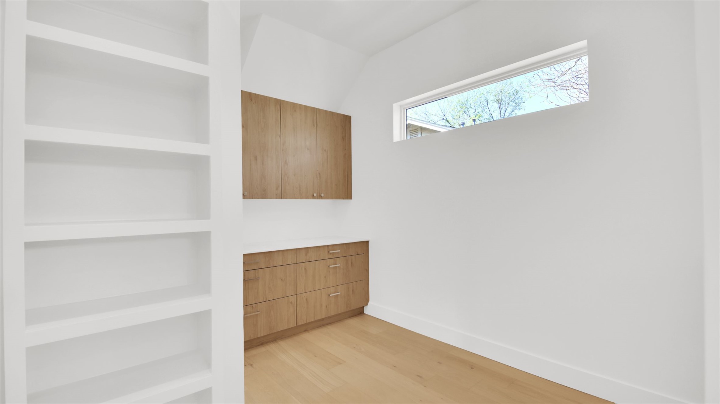 1310 Cullen Avenue Austin, TX 78757 - Photo 19 of 40 Primary suite closet with custom built-in cabinets with direct access to laundry room