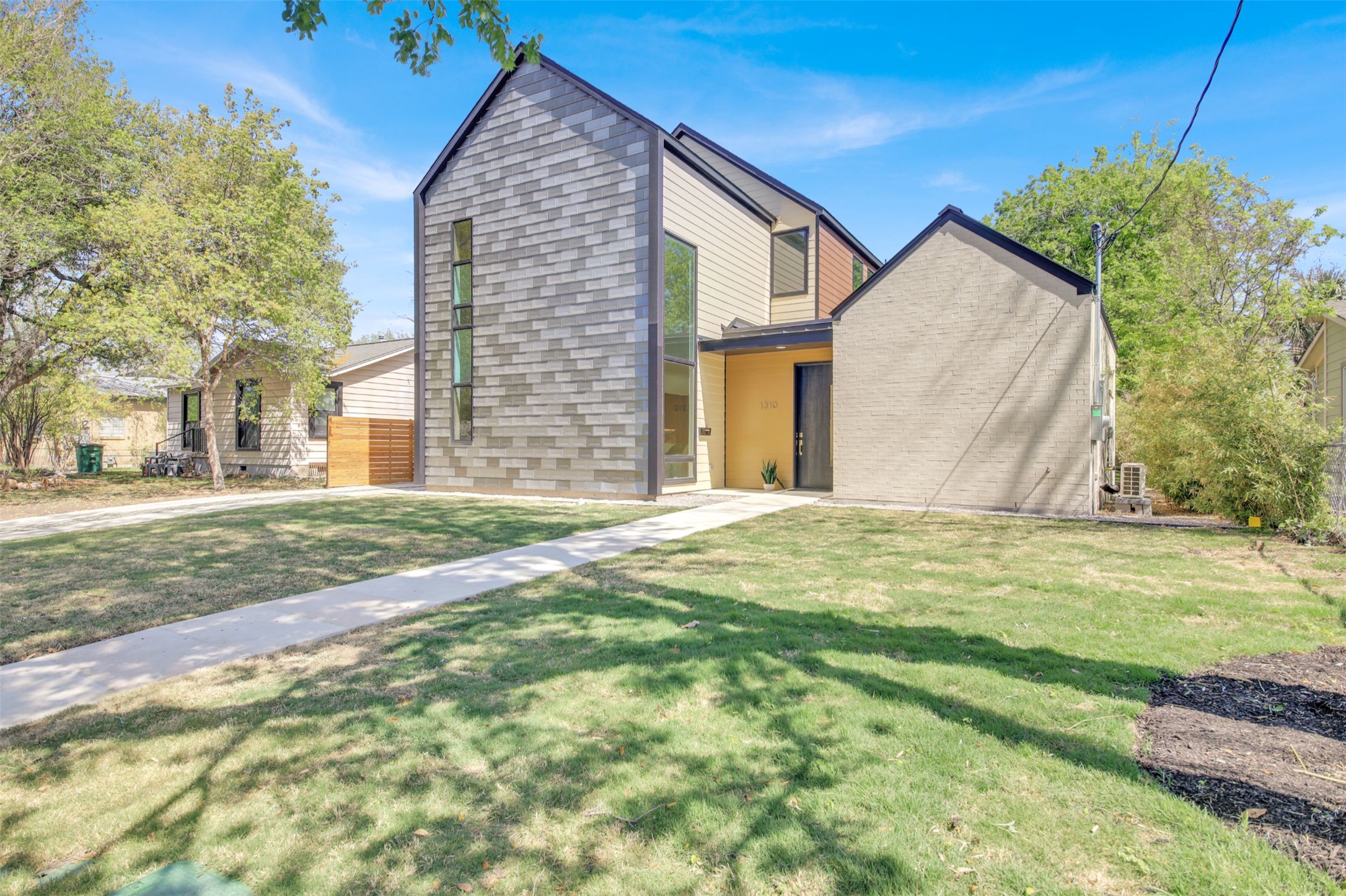 1310 Cullen Avenue Austin, TX 78757 - Photo 2 of 40 THE CROWN JEWEL OF CRESTVIEW!! View of front of house featuring a front lawn with sprinkler system.
