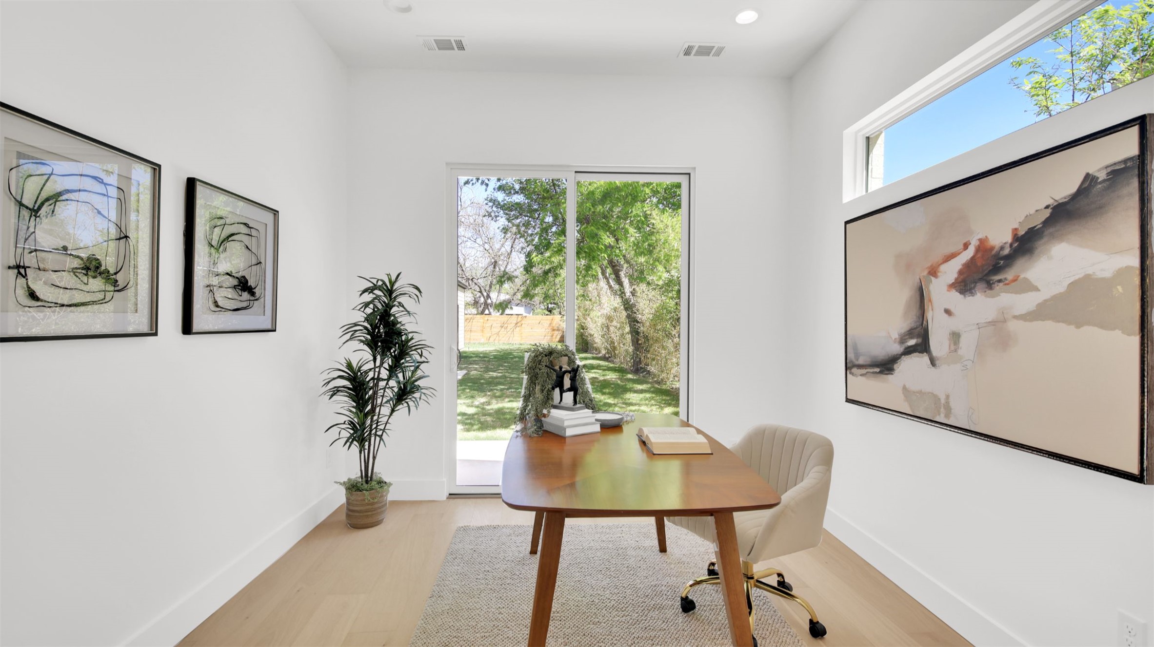 1310 Cullen Avenue Austin, TX 78757 - Photo 23 of 40 The Casita Office or bedroom with a large closet featuring light wood floors and recessed lighting