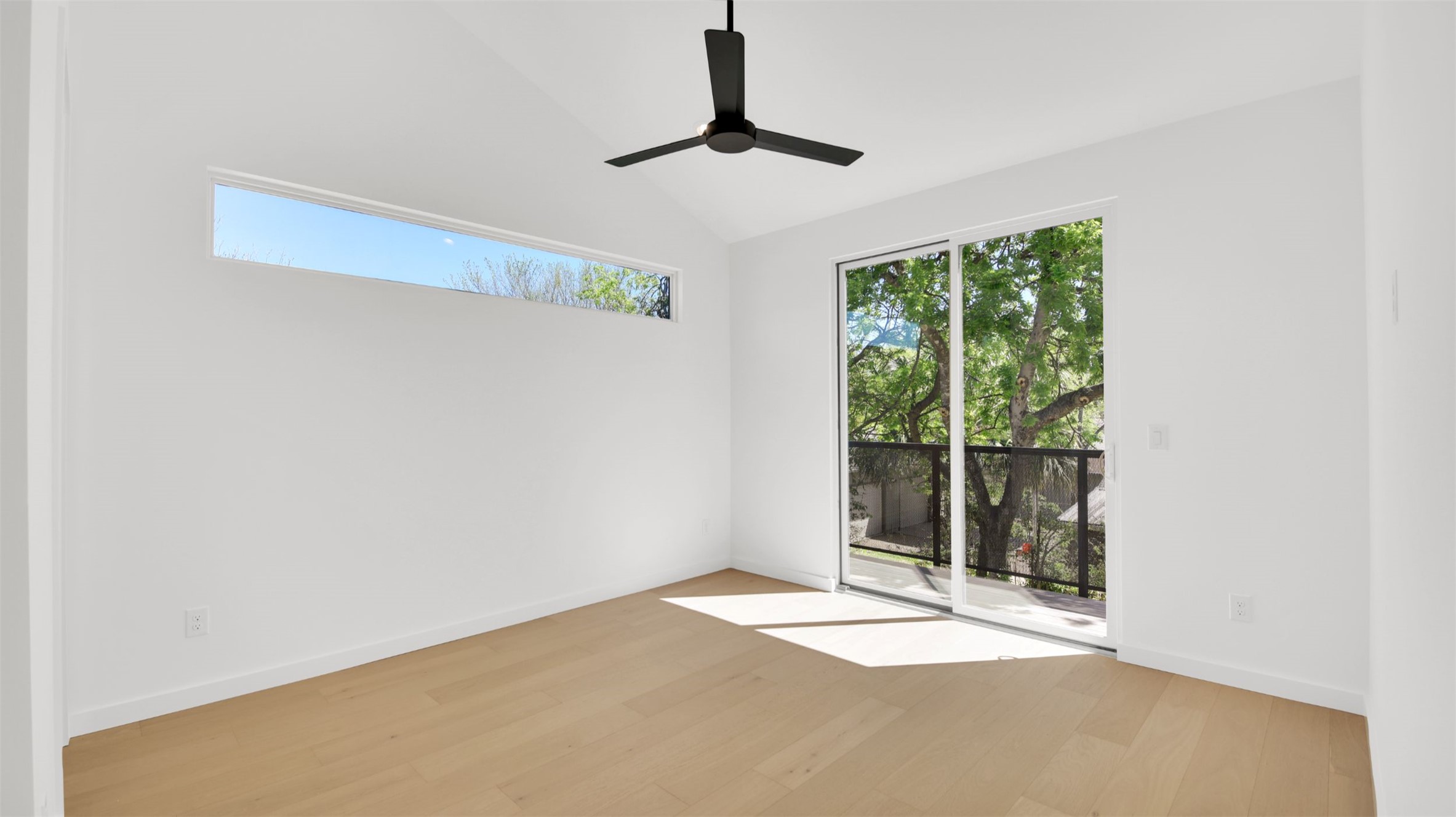 1310 Cullen Avenue Austin, TX 78757 - Photo 31 of 40 Bedroom featuring light wood flooring, vaulted ceiling, and a ceiling fan with attached bathroom and walk-in closet