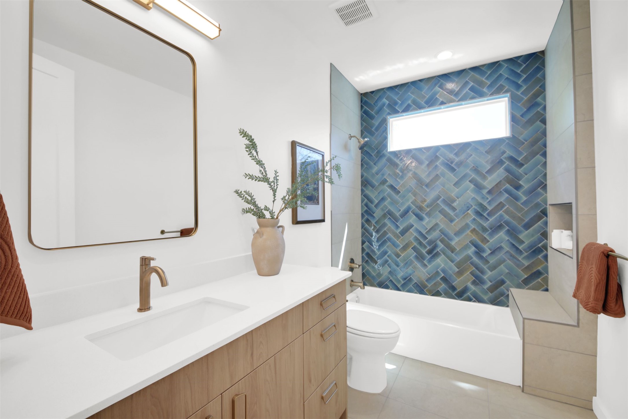 1310 Cullen Avenue Austin, TX 78757 - Photo 33 of 40 Bathroom featuring vanity, shower / tub combination, and light tile patterned floors