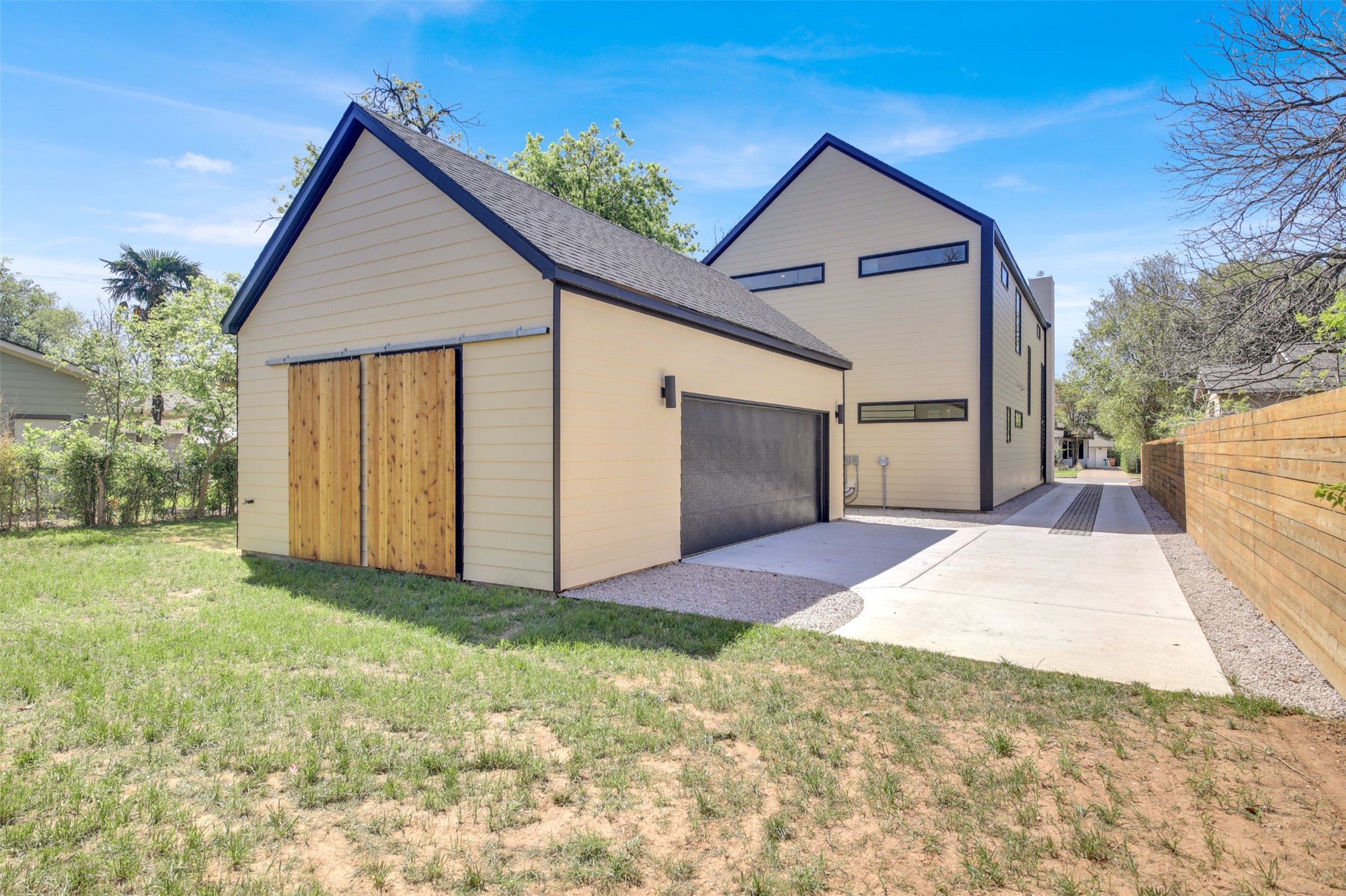 1310 Cullen Avenue Austin, TX 78757 - Photo 36 of 40 Oversize 2-car garage with openings on two sides, plus two storage closets with sliding barn doors