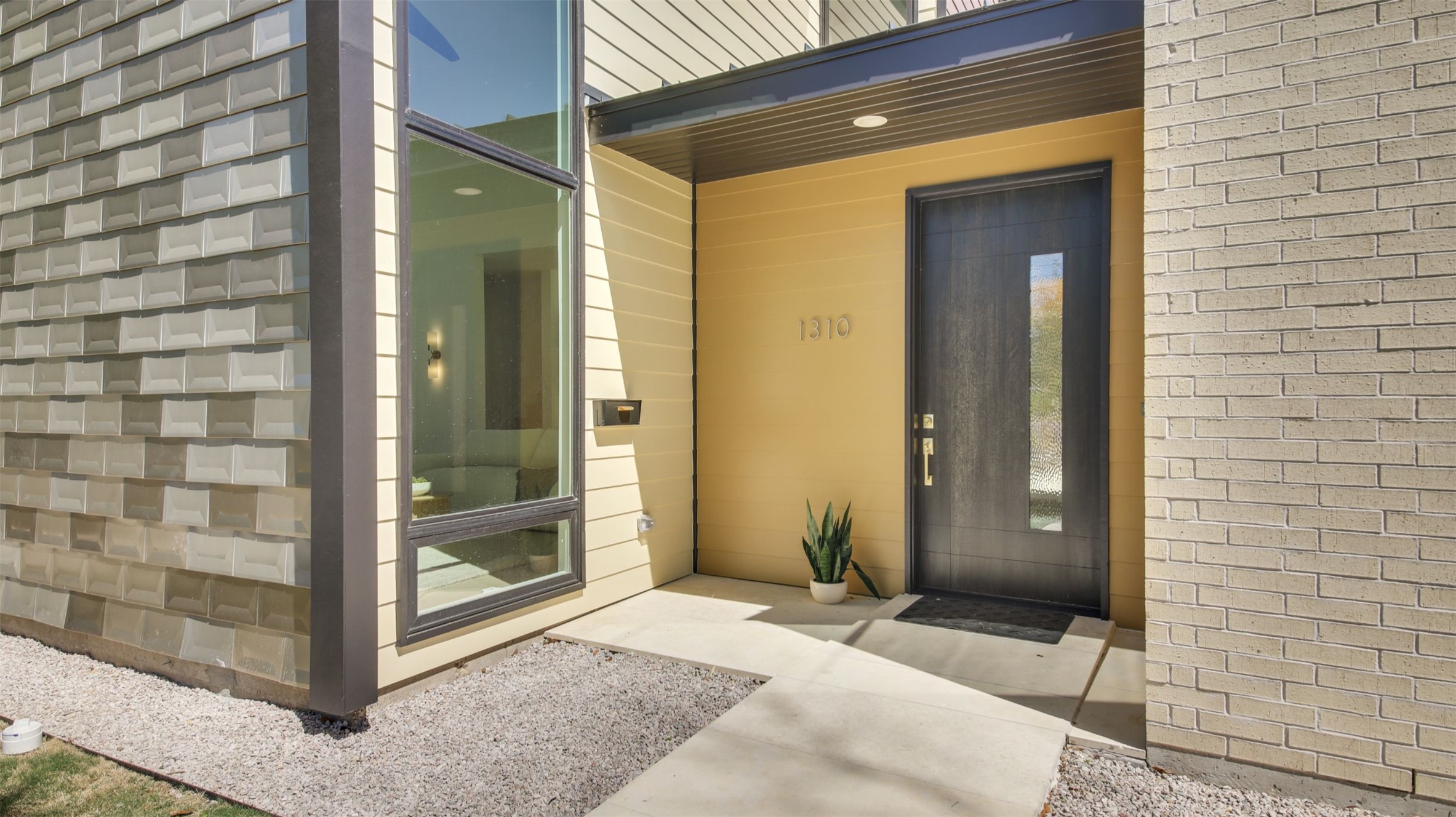 1310 Cullen Avenue Austin, TX 78757 - Photo 4 of 40 Entrance flanked by metal-tile-clad main house and brick Casita
